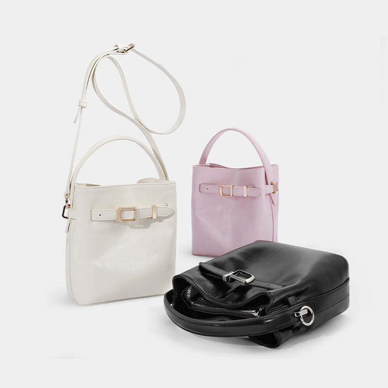 Modern Belted Crossbody and Handbag with a Sleek Structured Design
