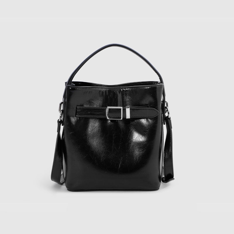 Modern Belted Crossbody and Handbag with a Sleek Structured Design